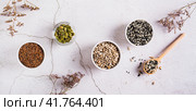Sesame, flax, pumpkin and sunflower seeds in bowls for women's health top view web banner. Стоковое фото, фотограф Елена Руй / Фотобанк Лори