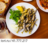 Delicious fried red mullet fish with parsley and lemon. Стоковое фото, фотограф Яков Филимонов / Фотобанк Лори