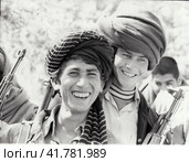 Молодые бойцы отряда самообороны. Советско–афганский конфликт. Старая фотография периода 1970-80-х годов. Редакционная иллюстрация, иллюстратор александр афанасьев / Фотобанк Лори