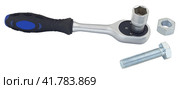 Торцевой гаечный ключ с болтом на белом фоне. Socket wrench with bolt on white background. Стоковое фото, фотограф Татьяна Д / Фотобанк Лори