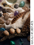 handmade stone runes on white fur. Стоковое фото, фотограф Boris Vasilenko / Фотобанк Лори