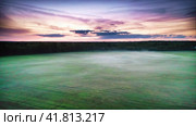 Mystical Post-Sunset, Veil of Fog Over Structured Fields Under a Crimson Sky. Aerial Drone Shot. Стоковое видео, видеограф Даниил Хабаров / Фотобанк Лори
