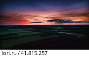 Enigmatic Nightfall. Fog Sweeping Over Patchwork Fields Under a Red-Purple Sky. Aerial Drone Shot. Стоковое видео, видеограф Даниил Хабаров / Фотобанк Лори