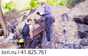 Ecologist walking at the place where the forest burned down. Стоковое видео, видеограф Chudakov_Ivan / Фотобанк Лори