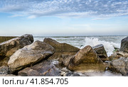 seascape with rocks and surf in the foreground. Стоковое фото, фотограф Артем Курутин / Фотобанк Лори