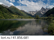 View of Lake Tumanly-Gel (Foggy Lake) in the valley of the Gonachkhir River on the territory of the Teberdinsky National Park on a sunny summer day, Dombay, Karachay-Cherkessia, Russia. Стоковое фото, фотограф Ula Ulachka / Фотобанк Лори