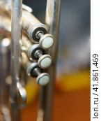 The silver trumpet pipe valves on the defocused background. Musical instrument photography. Стоковое фото, фотограф YuryKara / Фотобанк Лори