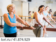 Group of active women practicing energetic dance in a studio. Стоковое фото, фотограф Яков Филимонов / Фотобанк Лори