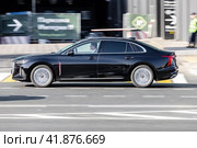 Black chinese car Hongqi H5 fast moving along city street. Редакционное фото, фотограф Константин Григорьев / Фотобанк Лори