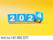 Calendar header number 2024 on   yellow background. Happy new year 2024 colorful background. Стоковое фото, фотограф Виталий Сова / Фотобанк Лори