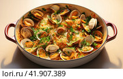 Spaghetti alle vongole with tomato in seafood jus served as close-up at a Nordic design bowl with copy space. Стоковое AI-изображение, AI-художник Ирина Ручушкина / Фотобанк Лори