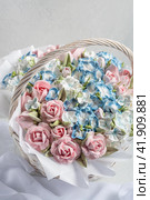 Zephyr bouquet of flowers in a gift box on a light background. Zephyr with a minimum amount of sugar. a natural product. Стоковое фото, фотограф Ирина Ручушкина / Фотобанк Лори