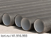 Черные пластиковые трубы для водоснабжения или канализации. Black plastic pipes for water supply or sewerage prepared for installation or repair of the water supply system. Стоковое фото, фотограф Татьяна Д / Фотобанк Лори