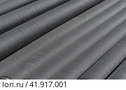 Черные пластиковые трубы для водоснабжения или канализации. Black plastic pipes for water supply or sewerage prepared for installation or repair of the water supply system. Стоковое фото, фотограф Татьяна Д / Фотобанк Лори