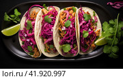 Row of Mexican street Tacos on slate with carne asada and al pastor in corn tortilla. Стоковое AI-изображение, AI-художник Ирина Ручушкина / Фотобанк Лори