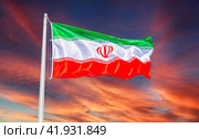Flag of Iran waving in the wind against the sky. Стоковое фото, фотограф FotograFF / Фотобанк Лори
