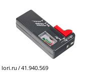 Измеритель заряда батареек на белом фоне. Meter battery tester batteries batteriemessger. Стоковое фото, фотограф Татьяна Д / Фотобанк Лори