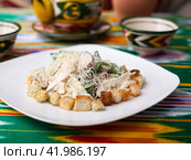 Malibu salad with crab sticks and croutons, feta cheese and vegetables. Asian style. Стоковое фото, фотограф Abakumova Ekaterina / Фотобанк Лори