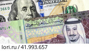 Saudi Arabia banknote with King Salman and American dollars banknote with Benjamin Franklin. Business concept of the exchange rate, stock exchange. Стоковое фото, фотограф FotograFF / Фотобанк Лори