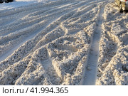 Uncleared road covered with dirty snow with traces of cars. Стоковое фото, фотограф Сергей Чайко / Фотобанк Лори
