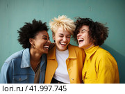 Three friends of different races are laughing merrily and looking at the camera. The concept of female friendship. Стоковое AI-изображение, AI-художник Ярославский Максим / Фотобанк Лори