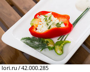 Pepper stuffed with brynza is tasty dish of Bulgarian cuisine. Стоковое фото, фотограф Яков Филимонов / Фотобанк Лори