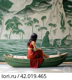 a woman in a red skirt is sitting in a boat with an airplane on the dock. Стоковое AI-изображение, AI-художник Юлия Гапеенко / Фотобанк Лори