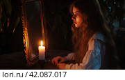 Девушка ночью гадает у зеркала с зажженной свечой. Стоковое AI-изображение, AI-художник Щеголева Ольга / Фотобанк Лори