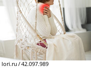 Sore throat and cough, woman with pain in neck at home. Стоковое фото, фотограф Станислав Тарко / Фотобанк Лори