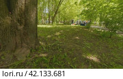 Cherepovets, Russia - May 27, 2023, Children shoot a toy slingshot, an interactive zone at a town festival. FPV Aerial Drone Shot. Редакционное видео, видеограф Даниил Хабаров / Фотобанк Лори