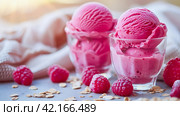 Two servings of vegan ice cream with raspberries in glasses. AI generated. Стоковое AI-изображение, AI-художник Ольга Губская / Фотобанк Лори