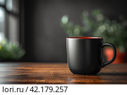Black mug with space for text on wooden kitchen table. Mock up. Стоковое AI-изображение, AI-художник Ирина Михайличенко / Фотобанк Лори