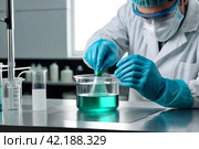 Close up hands doing chemical experiment on electroanalysis with reagents suspensions in laboratory, electrolysis process. Equipment for experiment. Chemical industry concept. Copy ad text space. Стоковое AI-изображение, AI-художник Aleksandr Golubev / Фотобанк Лори