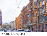 SAINT PETERSBURG, RUSSIA - January 17, 2024:  View of Kolokolnaya Street with historical buildings of Nikonov, Mineev, Nikolai of 18-19th century on winter day. Excursions and walks in city historical center. Редакционное фото, фотограф Виктория Катьянова / Фотобанк Лори