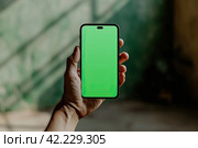 The smartphone user views the content with quick gestures, emphasizing the speed and convenience of digital interaction. Стоковое AI-изображение, AI-художник Ярославский Максим / Фотобанк Лори