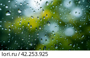 Glistening raindrops on windowpanes create a soothing, minimalist spring setting. Стоковое AI-изображение, AI-художник Юлия Гапеенко / Фотобанк Лори