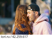 Moscow, Russia - May 9, 2022: Cheerful Dancing couple of young man and woman in public park. Lifestyle theme. Having fun people. People celevrate Victory Day, the win in the Great Patriotic War. Редакционное фото, фотограф YuryKara / Фотобанк Лори