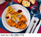 Breaded chicken breast with french fries closeup. Стоковое фото, фотограф Яков Филимонов / Фотобанк Лори