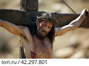 Jesus Christ on the Cross: A Symbol of Sacrifice and Salvation in the Christian Faith. Стоковое AI-изображение, AI-художник Юрий Поздников / Фотобанк Лори