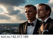 Pensive stylish man in tuxedo and bow tie posing at cloudy sky, thought looking away. Portrait of confident fashionable young guy businessman in tux, luxury image James Bond style. Copy ad text space. Стоковое AI-изображение, AI-художник Aleksandr Golubev / Фотобанк Лори
