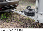 Tow hitch on a car. Trailer drawbar with spare wheel. Стоковое фото, фотограф Коханова Наталья / Фотобанк Лори