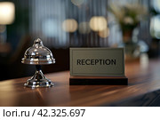 Стойка регистрации отеля с карточкой "Reception". Generative AI. Стоковое AI-изображение, AI-художник Щеголева Ольга / Фотобанк Лори