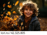 Little boy having fun during stroll in the forest at sunny autumn day. Child playing maple leaves. Baby tossing the leaves up. Active family time on nature. Hiking with little kids. Dry leaves rustle. Стоковое AI-изображение, AI-художник Ирина Михайличенко / Фотобанк Лори