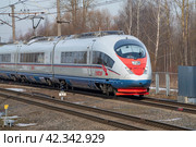 Скоростной электропоезд  ЭВС1-11 "Сапсан" мартовским днем. Октябрьская железная дорога (2024 год). Редакционное фото, фотограф Виктор Карасев / Фотобанк Лори