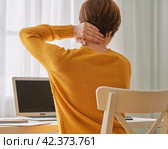 Back view of faceless woman feeling pain in neck. Remote work di. Стоковое фото, фотограф Natalia Gdovskaia / Фотобанк Лори