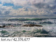 Oceanic water with waves and foam, natural background. Fantastic seascape of Itzurun beach in Zumaia in Basque Autonomous Community country in summer day. Стоковое фото, фотограф YuryKara / Фотобанк Лори