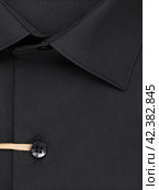 Close-up of a button placket on a black shirt. Стоковое фото, фотограф Сергей Чайко / Фотобанк Лори