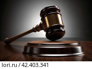 Wooden judge's hammer close-up. Стоковое AI-изображение, AI-художник RamA / Фотобанк Лори