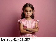 Serious funny little girl in pink dress arms crossed at pink backdrop, posing serious looking. Lovely kid lady coquette expressing emotion, studio shot. Child image emotion concept. Copy ad text space. Стоковое AI-изображение, AI-художник Aleksandr Golubev / Фотобанк Лори