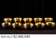 Sonorous Golden singing bowls. Generate Ai. Стоковое AI-изображение, AI-художник Иван Рябоконь / Фотобанк Лори